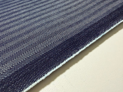 Okayama Denim fabric showcasing a blue herringbone stripe pattern with a rich texture.