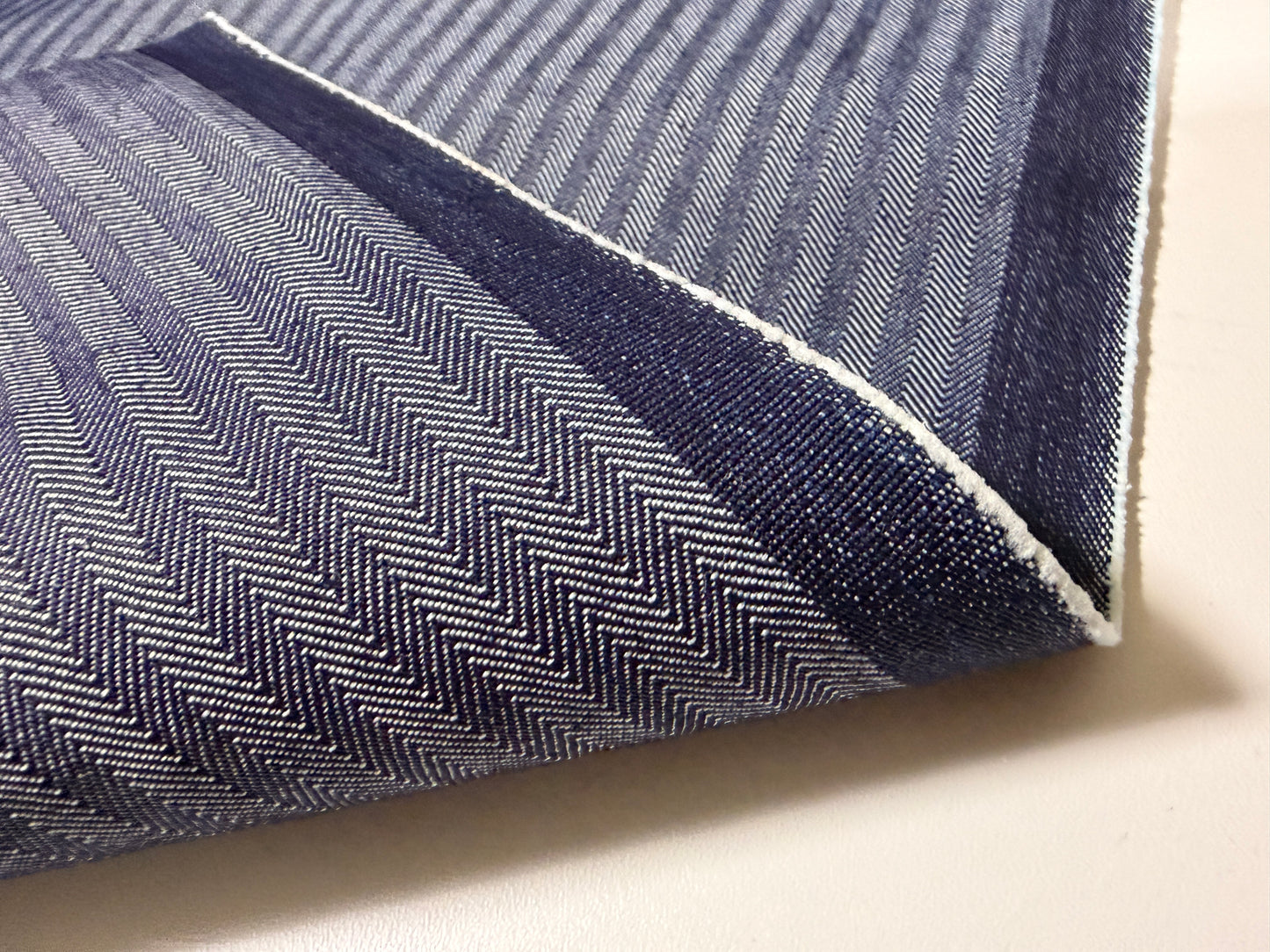 Okayama Denim 10.5 oz Japanese Cotton Herringbone Stripe Blue Fabric showing rich texture and reversible design.