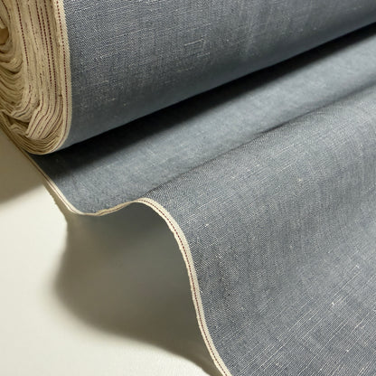 Okayama Denim grayish-blue slub chambray fabric with red selvage displayed in a rolled yard.