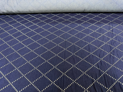 Okayama Denim - 7 oz blue & white sashiko cotton fabric with unique diamond pattern.