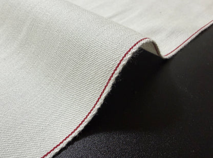 Okayama Denim rare 9.5 oz selvage plane weave cotton fabric with red selvedge edge.