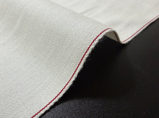 Okayama Denim rare 9.5 oz selvage plane weave cotton fabric with red selvedge edge.