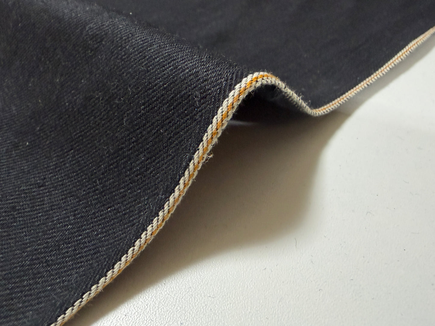 Okayama Denim | 10.5 oz Double-sided Black Denim Orange Selvage