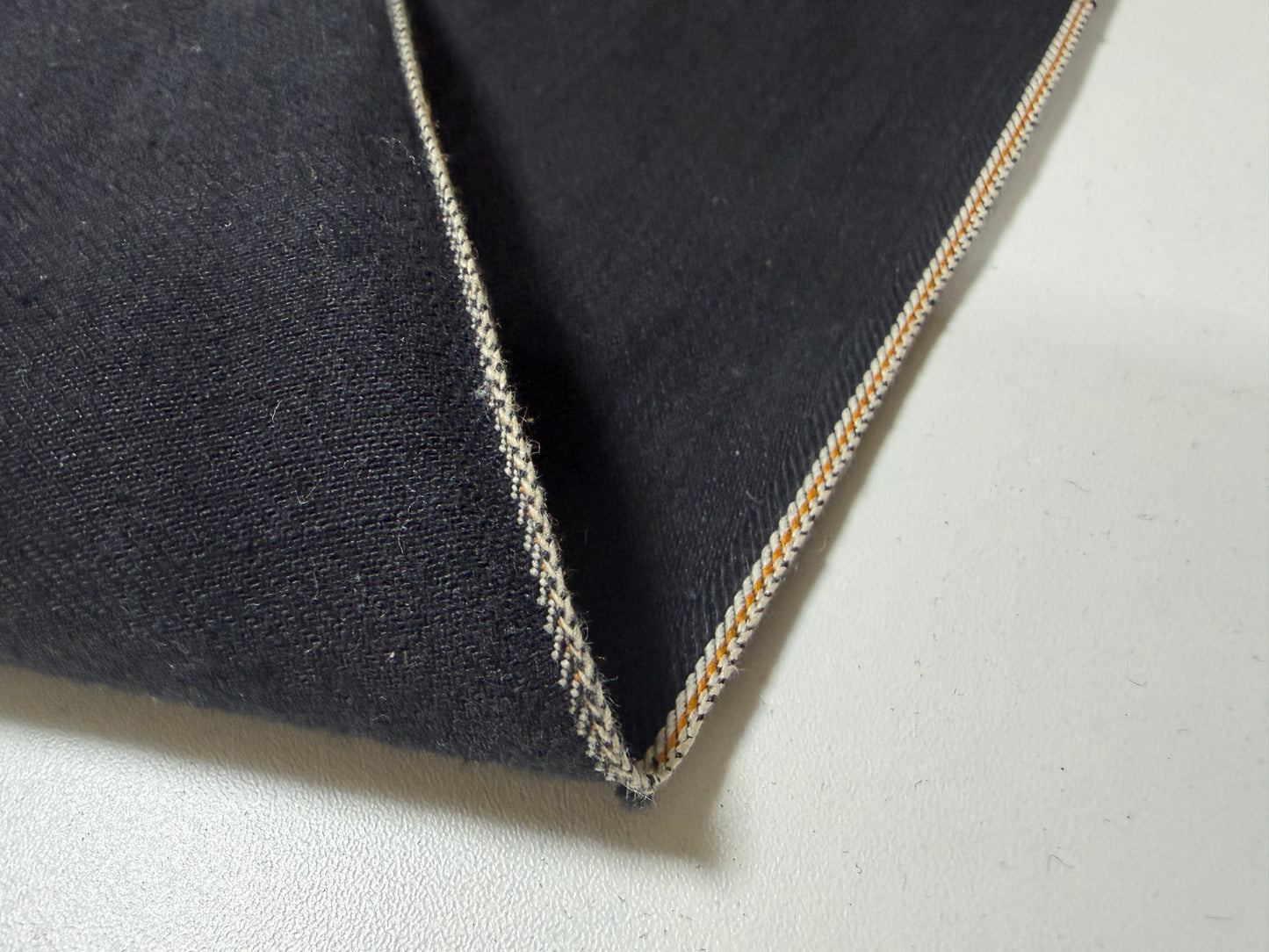 Okayama Denim | 10.5 oz Double-sided Black Denim Orange Selvage