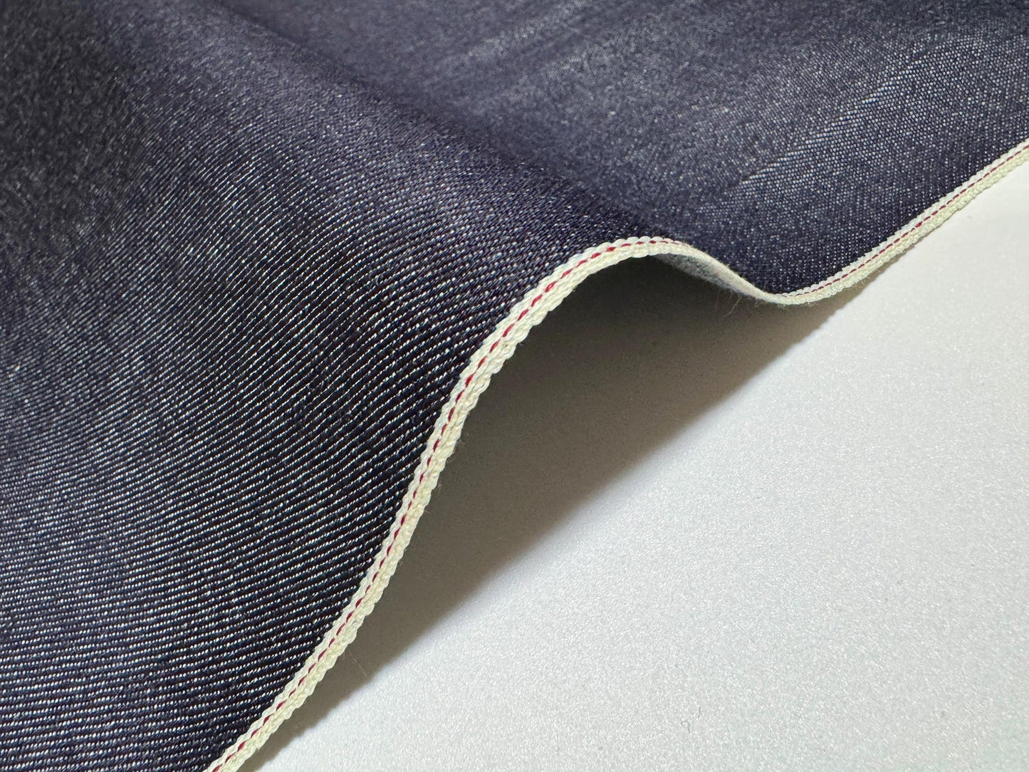 Okayama Denim - 10.5 oz Japanese Indigo Selvage Denim fabric with red selvage detail.