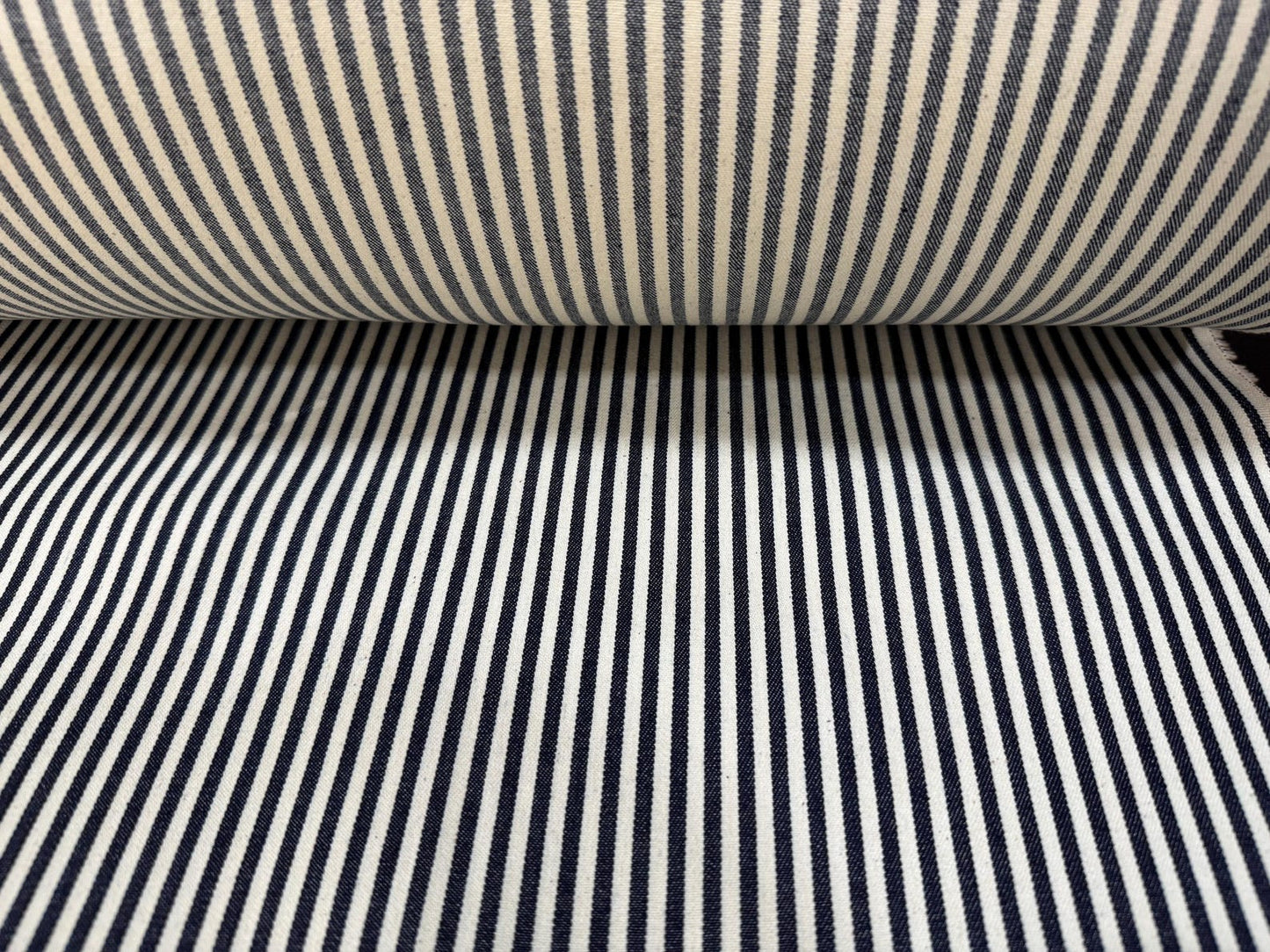 Okayama Denim fabric featuring a 10oz double width indigo hickory striped pattern, ideal for sewing and crafting.