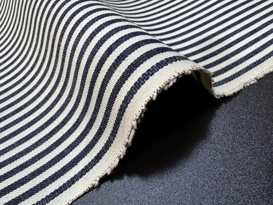 Okayama Denim 10oz double width indigo hickory fabric with navy stripes, showcasing its texture and color.