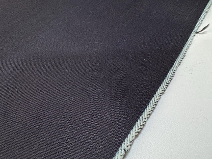Okayama Denim 12 oz double-sided indigo selvage fabric showcasing deep navy blue color and selvedge edge.
