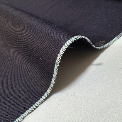 Okayama Denim - 12 oz double-sided indigo selvage showcasing smooth texture and classic selvage edge.