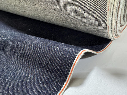 Okayama Denim 13 oz indigo kibata Japanese selvage denim fabric showing orange selvage detail.