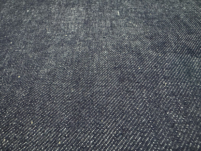 Okayama Denim 13 oz indigo kibata Japanese selvage denim fabric close-up showing texture and weave.