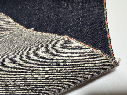 Okayama Denim 21oz Japanese heavy ounce indigo selvage showcasing intricate weave and texture details.