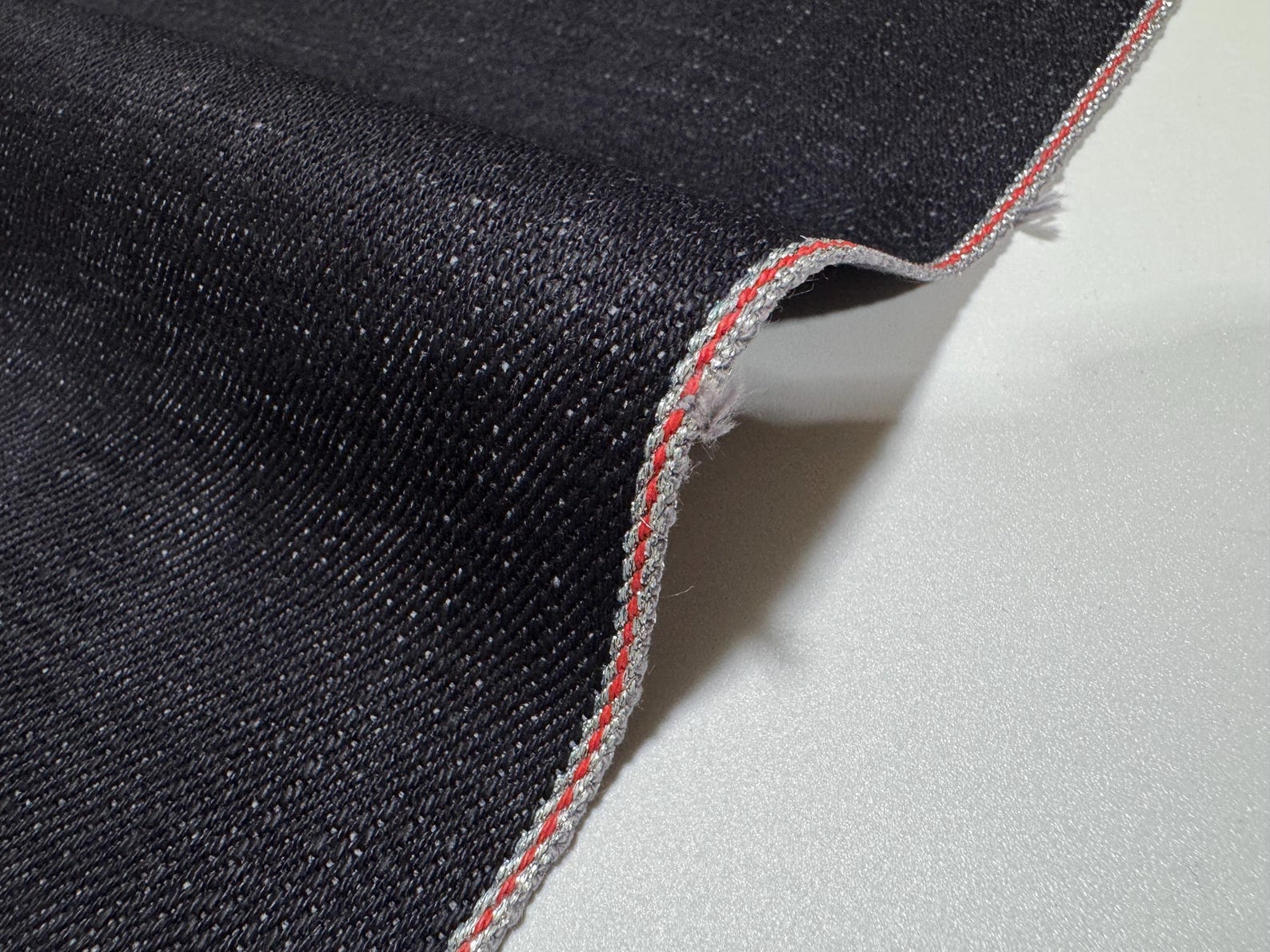 Okayama Denim | 20oz Japanese Heavy Ounce Indigo Selvage denim fabric with red selvedge edge.