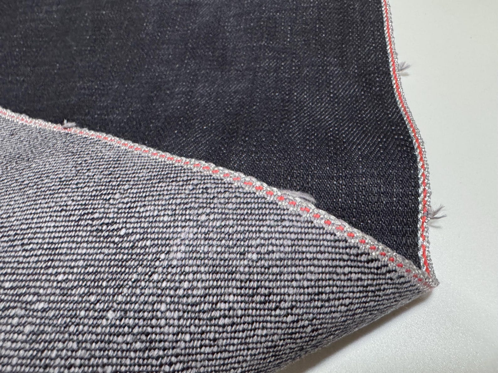 Okayama Denim | Close-up of 20 oz Japanese heavy ounce indigo selvage denim showing weaving details.