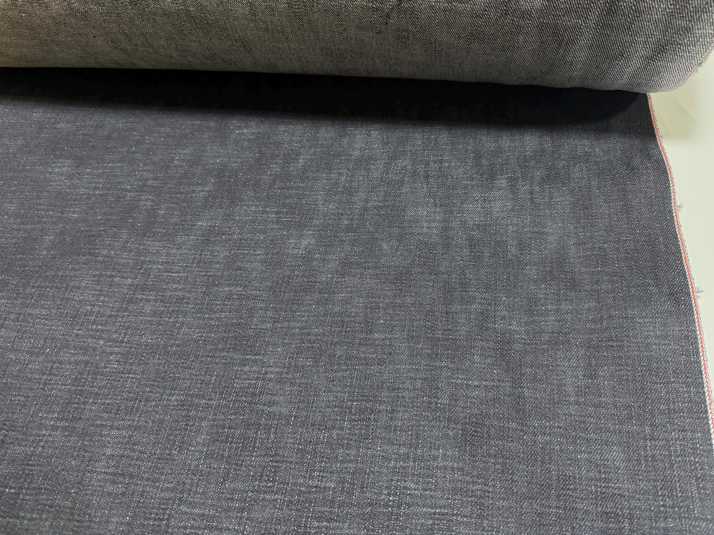 Okayama Denim | 20oz Japanese Heavy Ounce Indigo Selvage denim fabric showing rich indigo texture and weave.