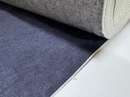 Okayama Denim | 11.5oz indigo rigid selvage Japanese denim fabric roll showcasing its smooth texture and dark blue color.
