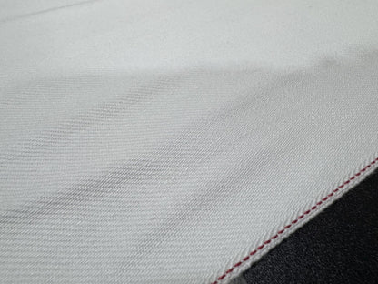 Okayama Denim fabric featuring 13 oz white selvedge with red edge, highlighting Japanese craftsmanship.