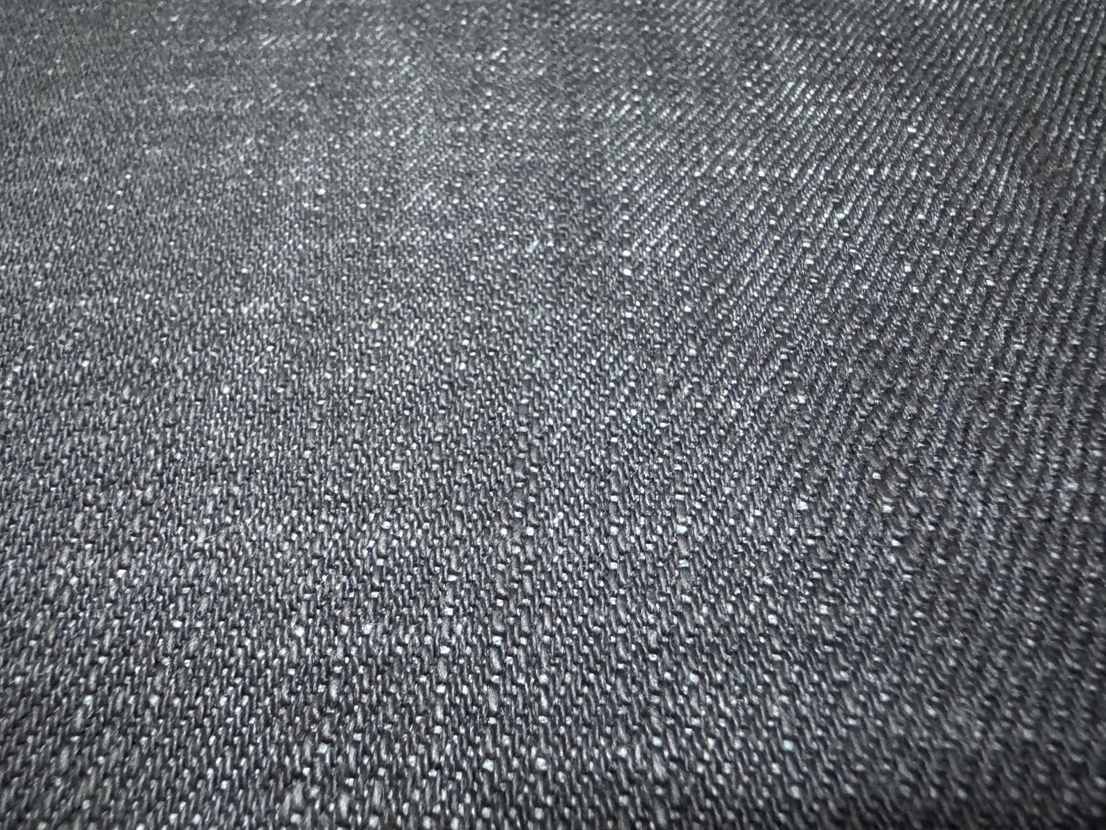 Okayama Denim fabric showcasing 20 oz Japanese heavy ounce indigo selvage denim texture.