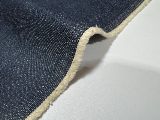Okayama Denim | 12.5oz Double Width Indigo Japanese denim fabric showing texture and edge detail.