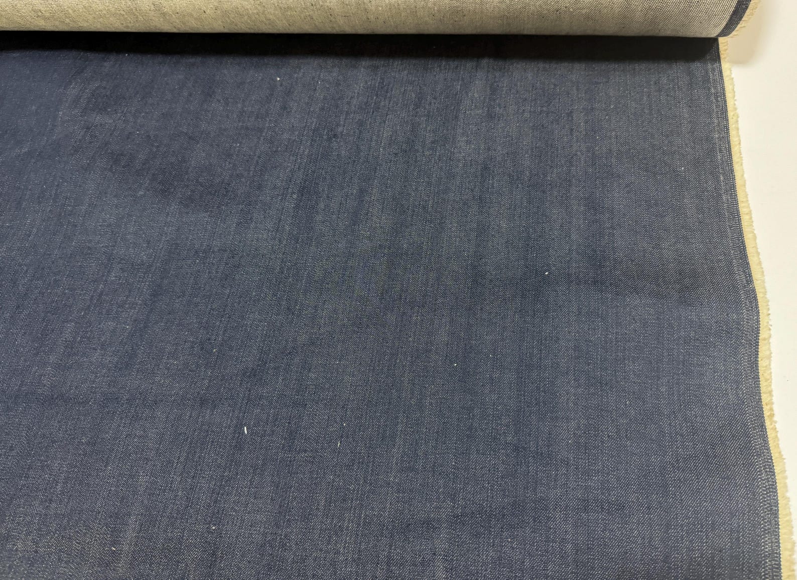 Okayama Denim 12.5oz Double Width Indigo Japanese denim fabric yard showcasing dark blue texture.