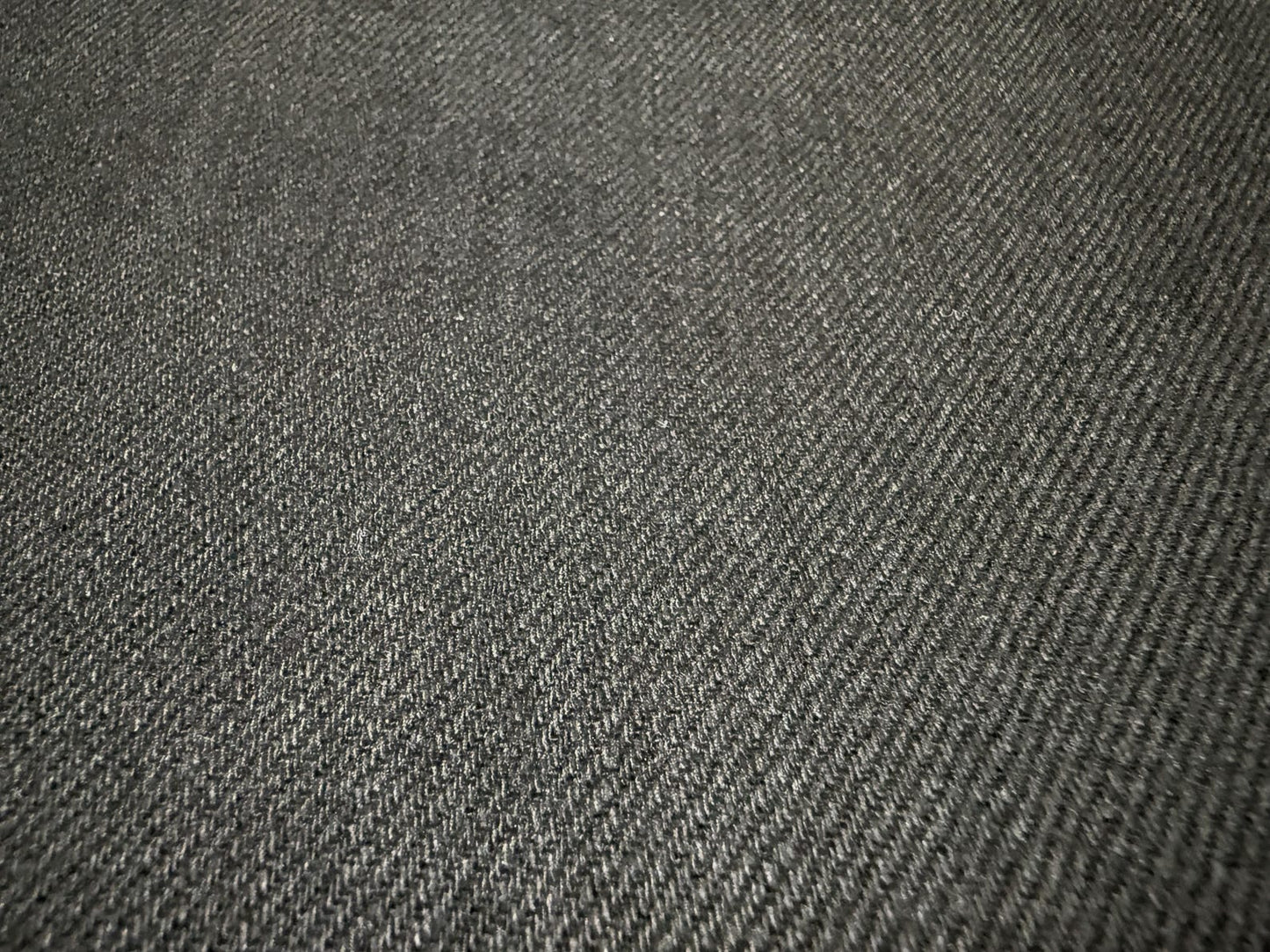 Close-up of Okayama Denim | 11oz Double-sided Black Japanese Black Selvage showing its smooth texture and weave.