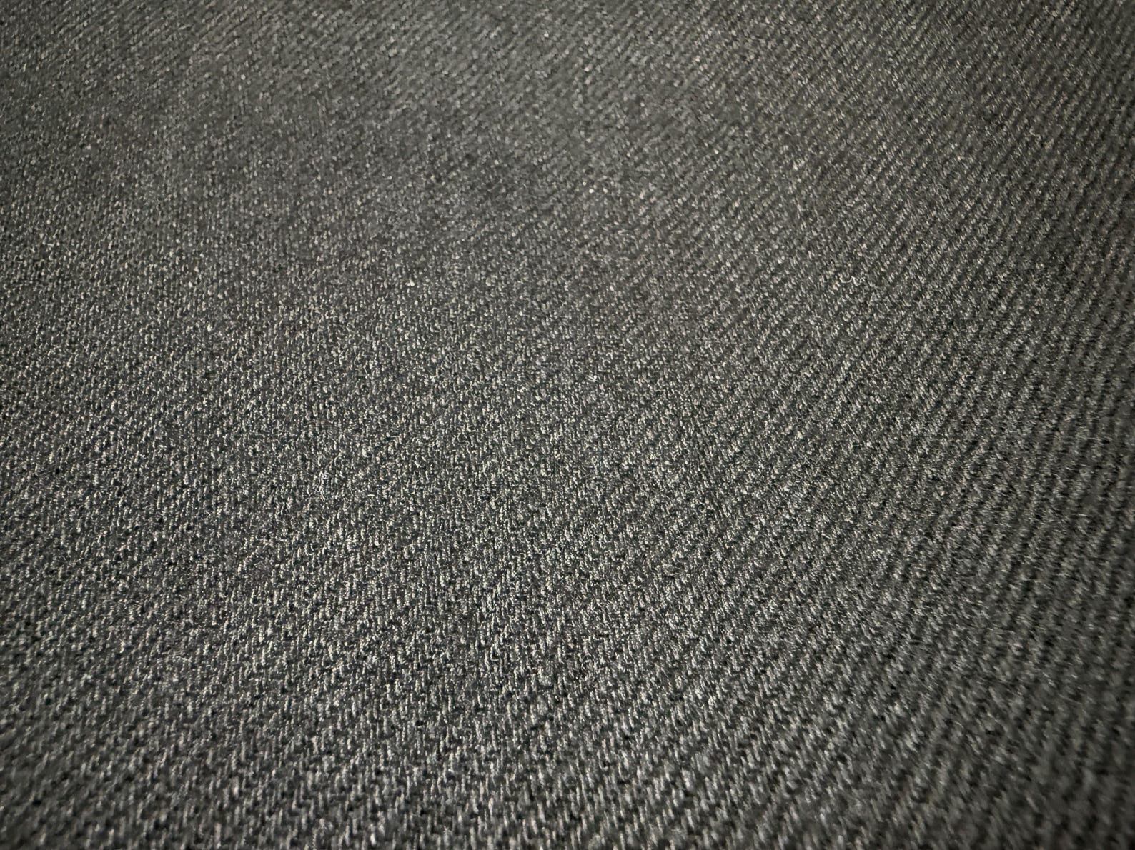 Close-up of Okayama Denim | 11oz Double-sided Black Japanese Black Selvage showing its smooth texture and weave.