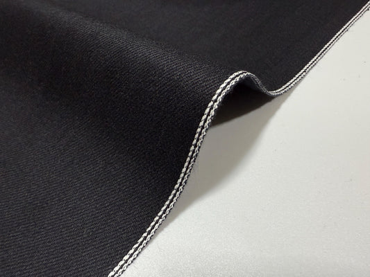 Okayama Denim | 11oz Double-sided Black Japanese Black Selvage fabric with white stitching detail.
