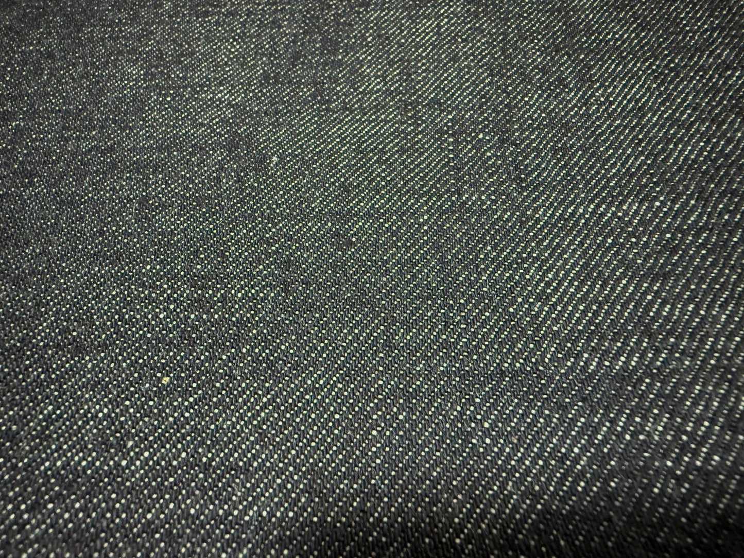 Okayama Denim 13.5 oz indigo Japanese selvage denim fabric texture close-up.