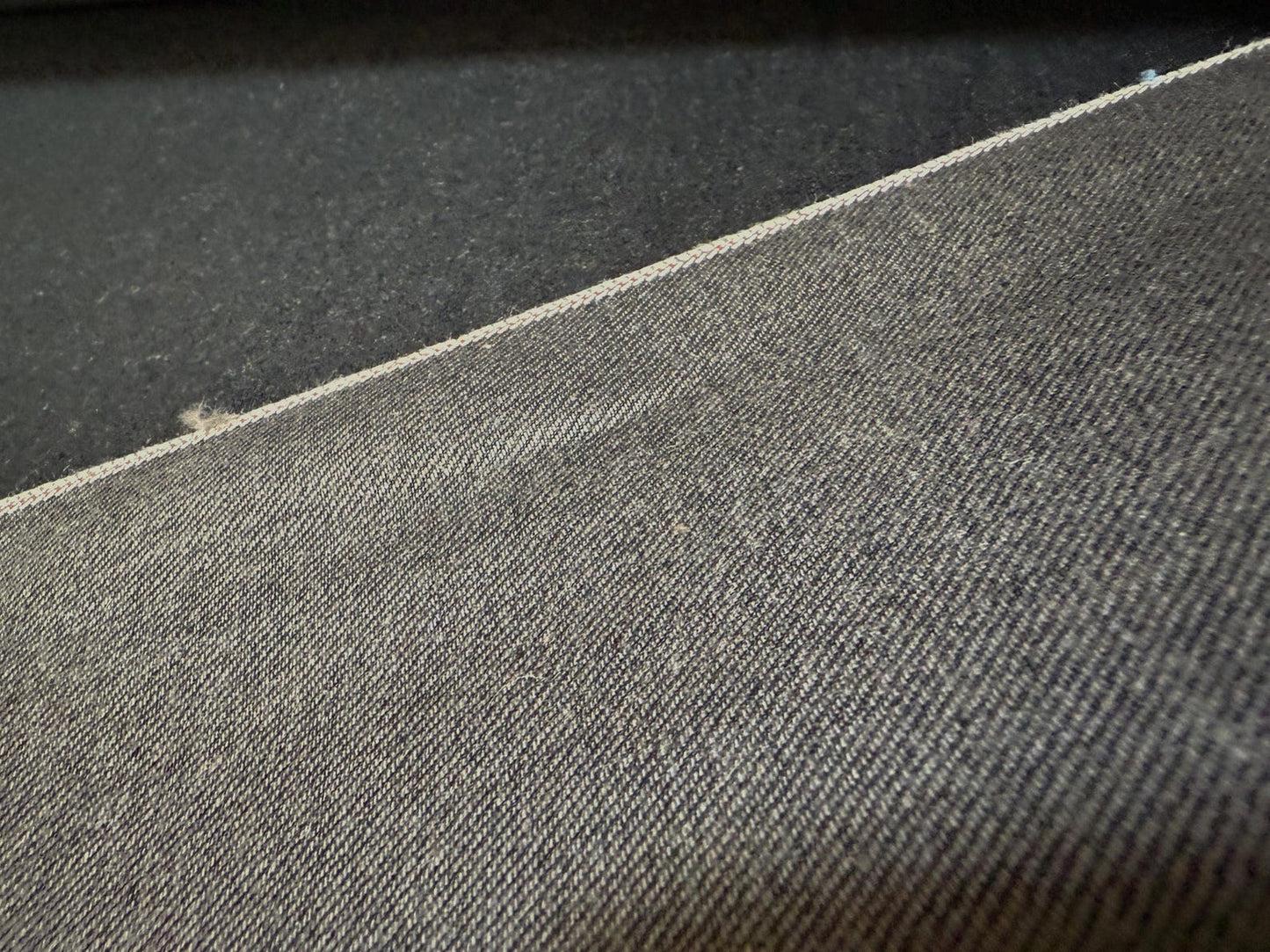 Okayama Denim 13.5 oz black/gray Selvage Japanese Denim showing premium texture and fabric details.