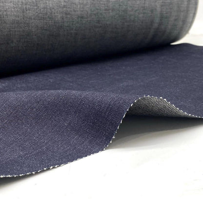 Okayama Denim 15.5oz indigo selvage Japanese blue fabric roll showcasing smooth texture and selvage edges.