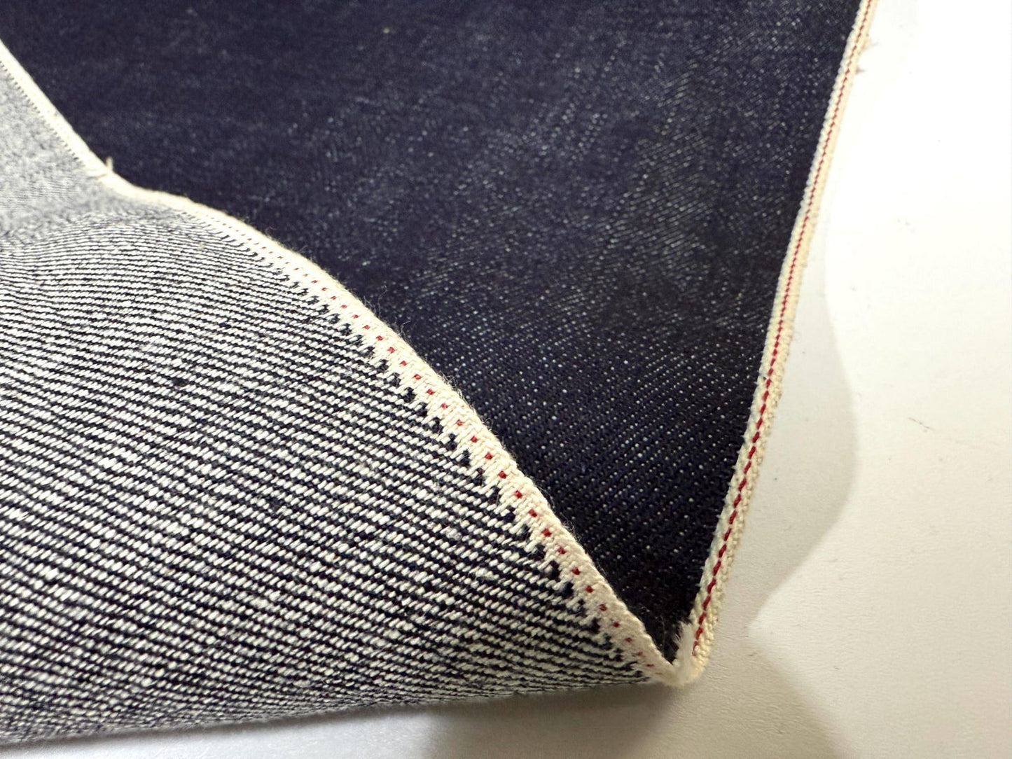 Okayama Denim | 15.5oz Indigo Selvage Japanese Blue Fabric showcasing deep indigo color and selvedge edges.
