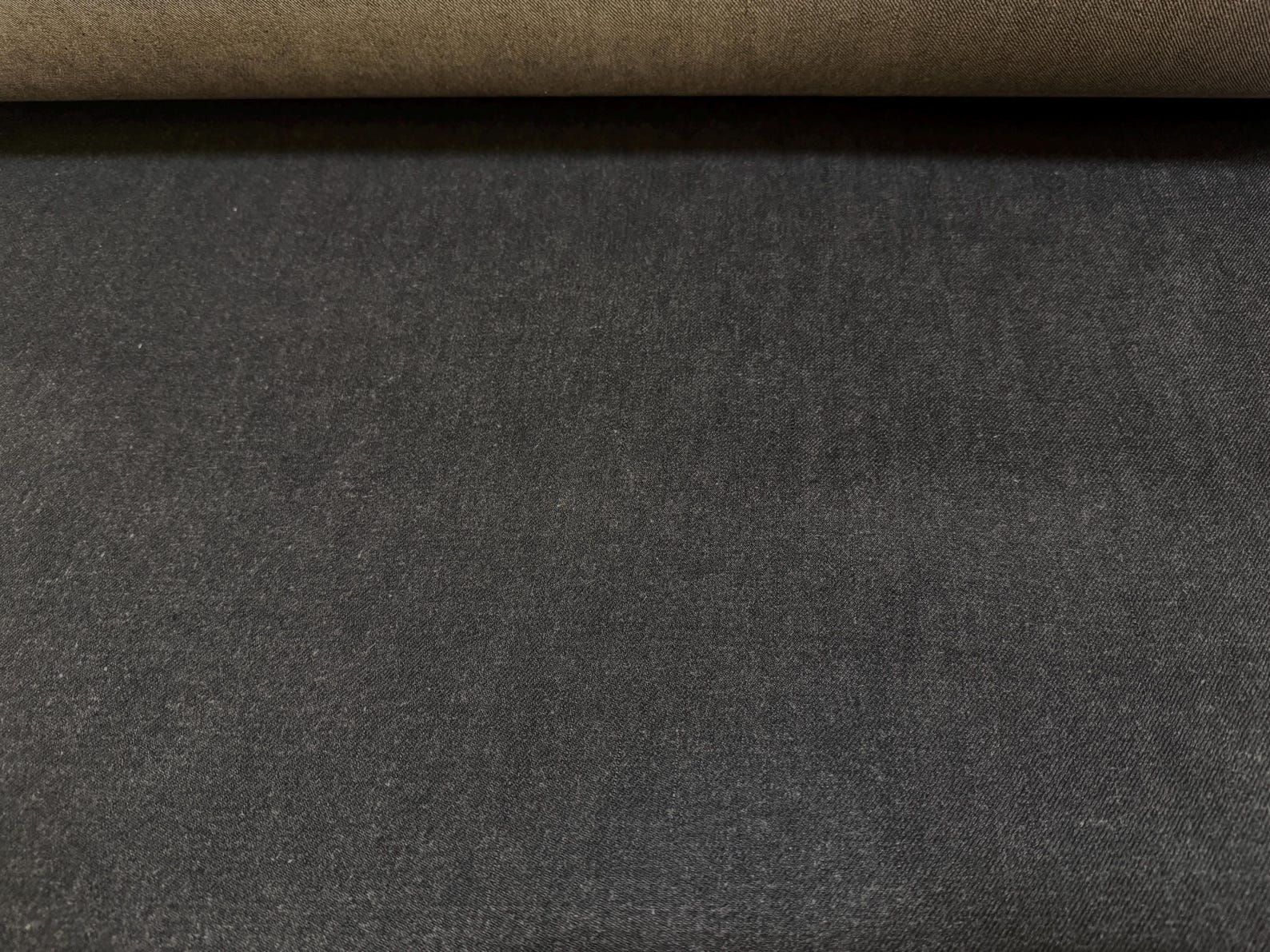 Okayama Denim | 13.5oz black/gray Japanese Selvage Denim fabric showing smooth texture and quality craftsmanship.