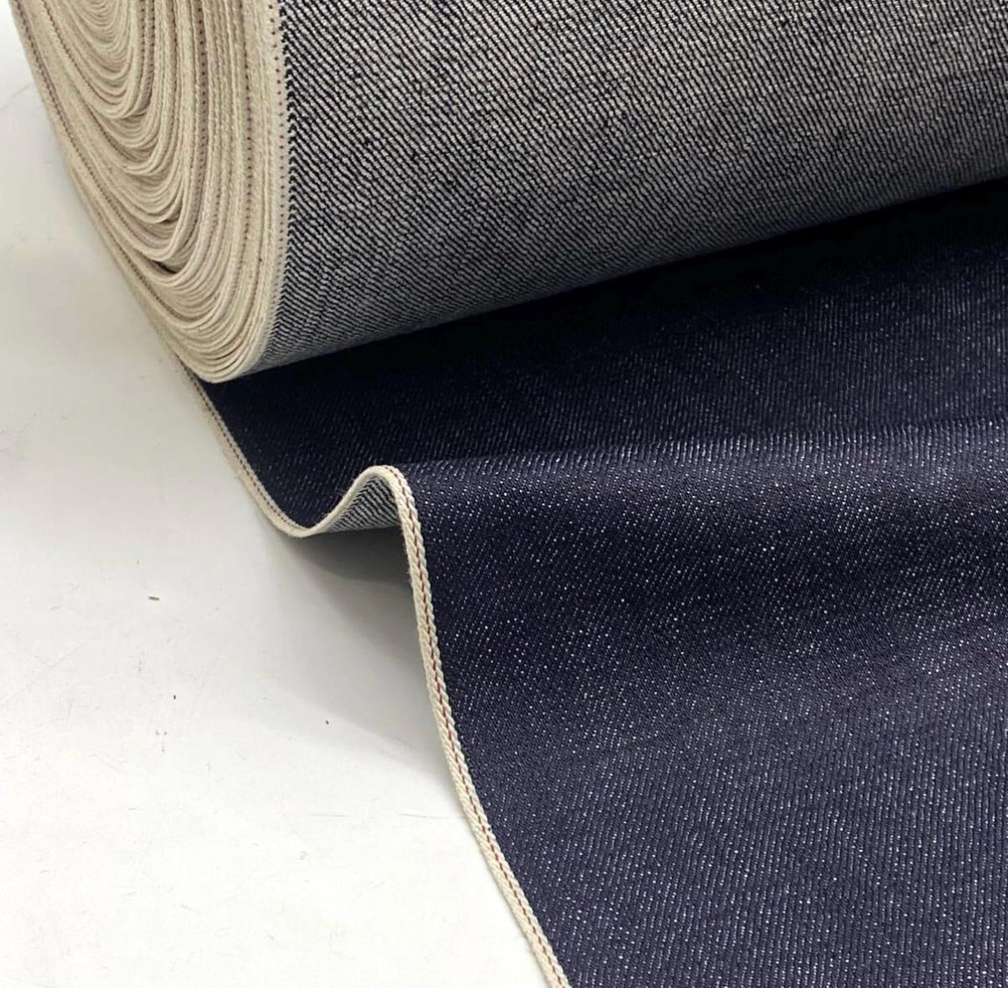Okayama Denim 15.5oz indigo selvedge fabric roll with matching blue selvage edges